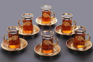 Set of six gold-rimmed tea cups 